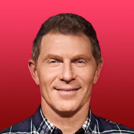 Bobby Flay poses in a photoshoot.